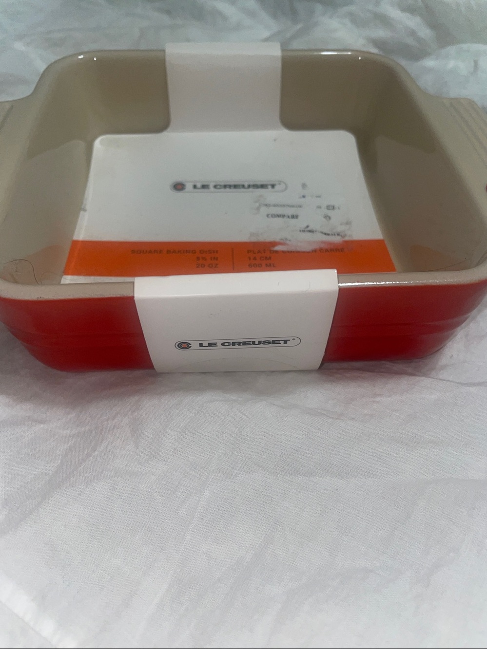 Brand New Le Creuset 5 1/2” square red baking dish that holds 20oz